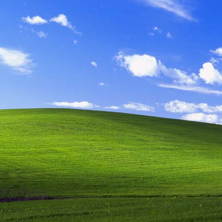 Какое бедствие сделало возможным появление пейзажа на фоне рабочего стола Windows XP?